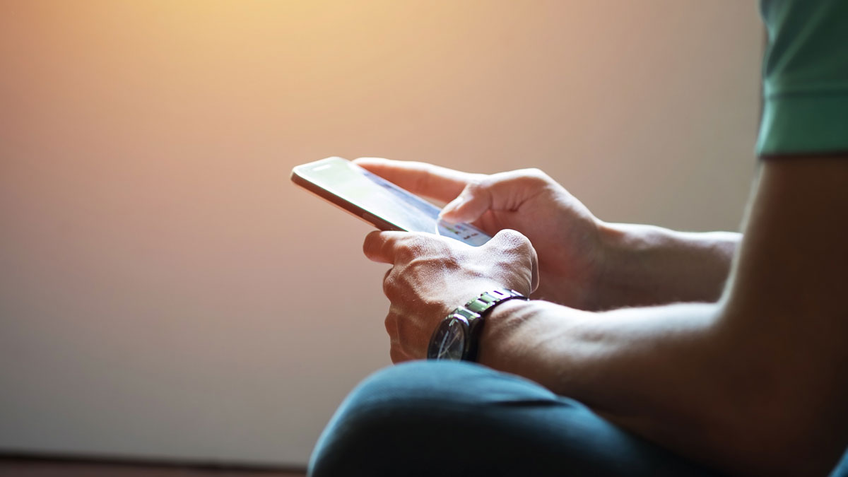 person texting on a smart phone