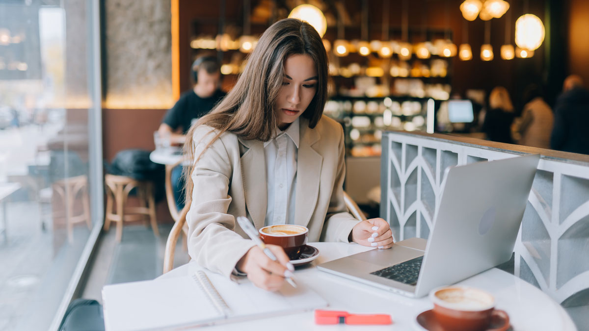 woman working remotely from cafe