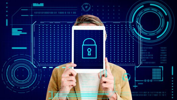 woman holding tablet over face with security graphic overlay