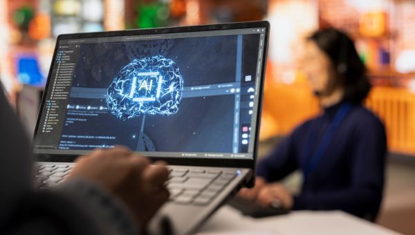worker using ai tool on laptop
