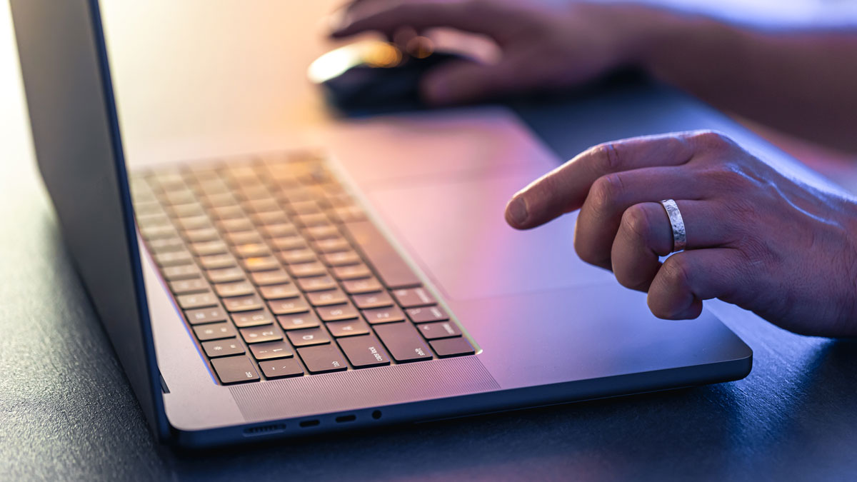 close up of person using laptop